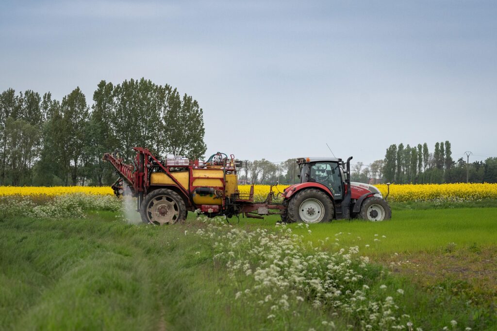 Tractor spraying a field